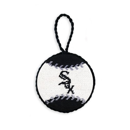 White needlepoint ornament with the black Chicago White Sox diagonal script logo, finished with a white hanging cord.
