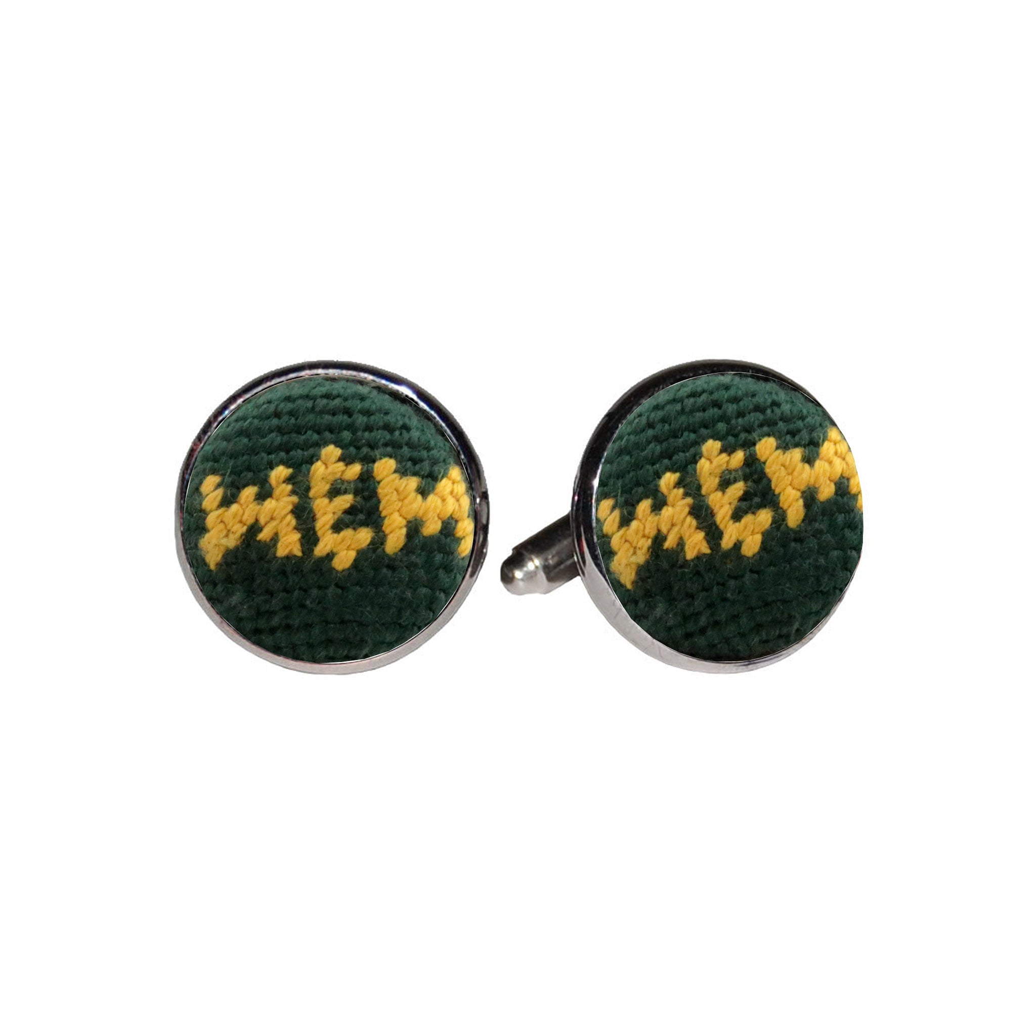 William & Mary cufflinks with the green and gold collegiate logo stitched in needlepoint, set into a silver-plated cufflink.