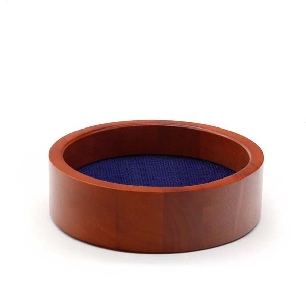 Round wooden wine bottle coaster featuring a dark navy needlepoint insert