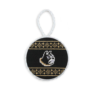 Black needlepoint ornament featuring the gold Wofford “W” logo, finished with a white hanging cord.
