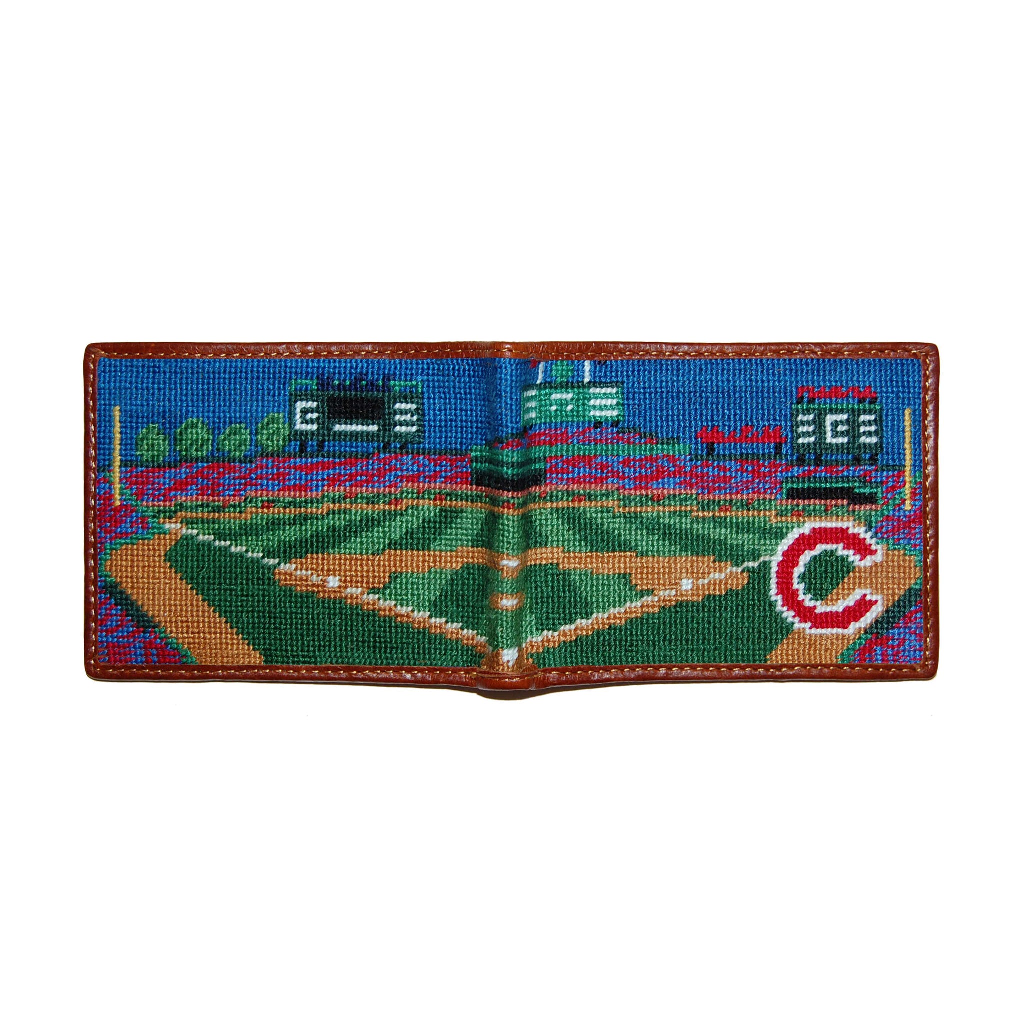 Wrigley Field navy needlepoint bi-fold wallet open to show both sides of the red Wrigley Field logo needlepoint design with brown leather trim.