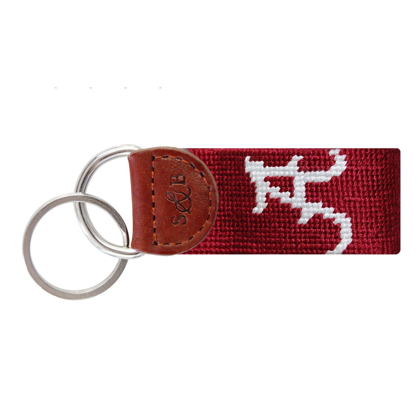 Crimson needlepoint key fob featuring a white Alabama “A” logo, brown leather trim, and a metal key ring.