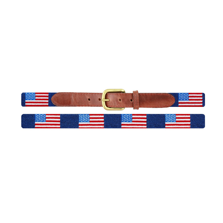 American flag stitched design on a classic navy needlepoint children’s belt with brown leather ends and a brass buckle.