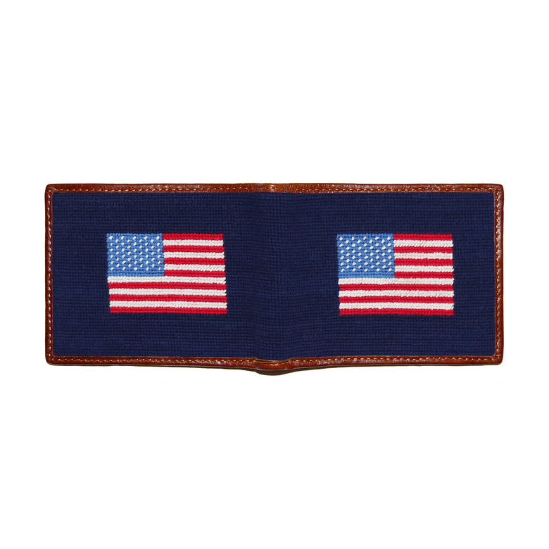 Dark navy needlepoint wallet open to show both sides of the American flag needlepoint design with white stitching.