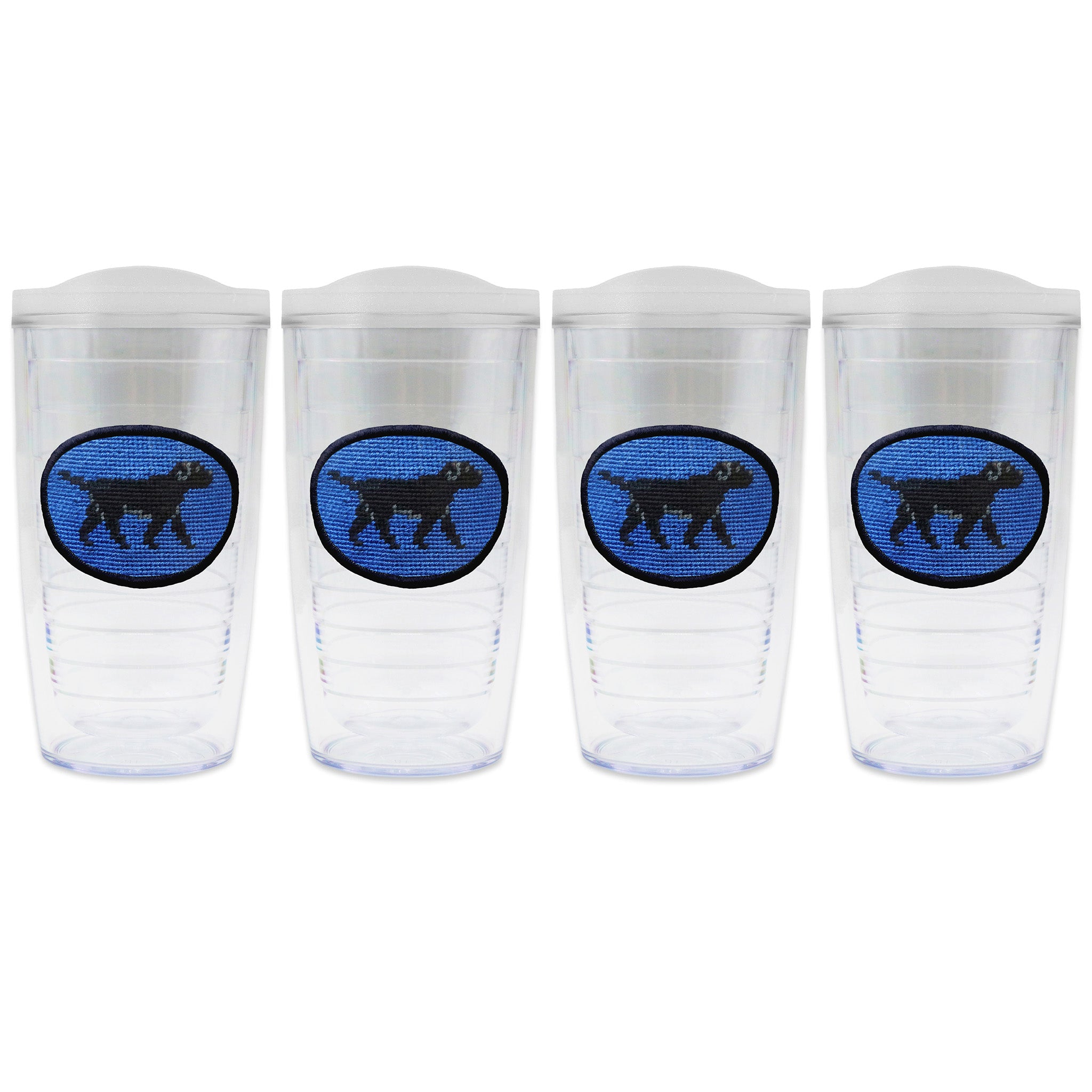 Set of 4 tumblers with lids on each in a line with a needlepoint logo in the center of each tumbler