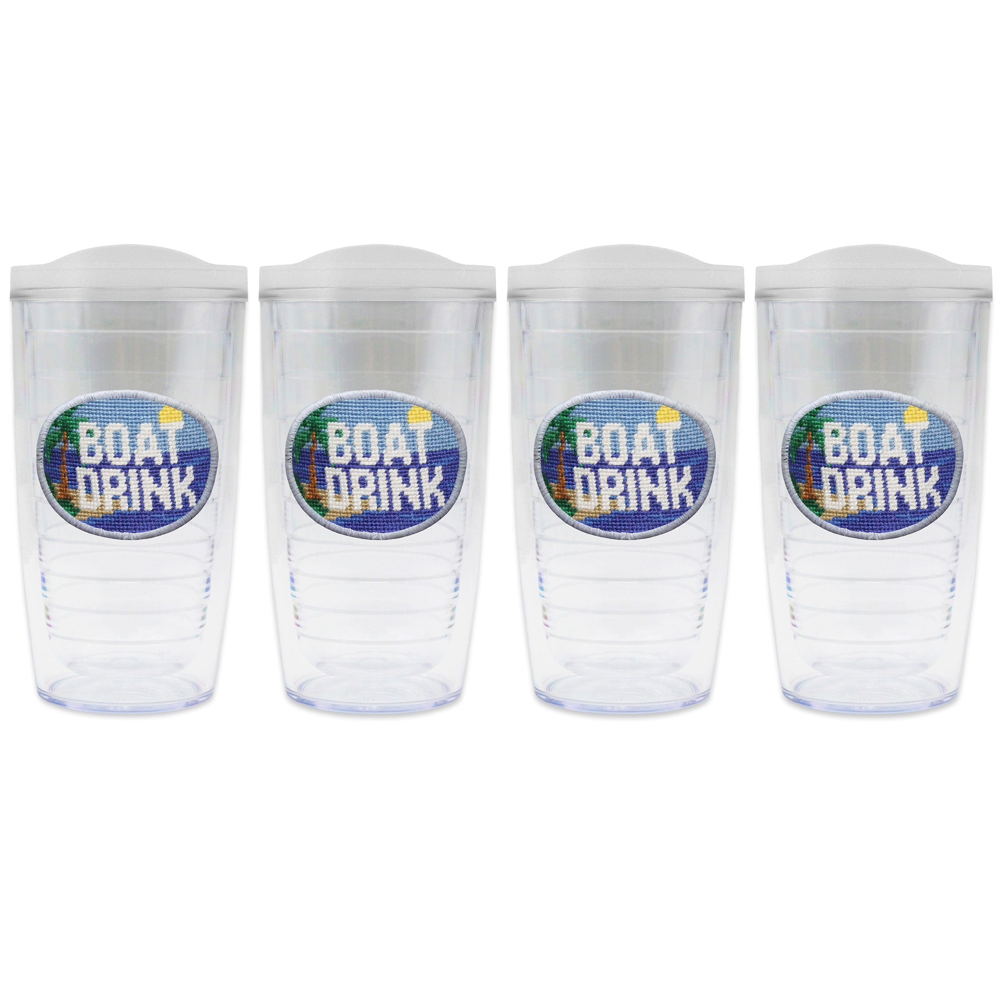 Set of 4 tumblers with lids on each in a line with a needlepoint logo in the center of each tumbler