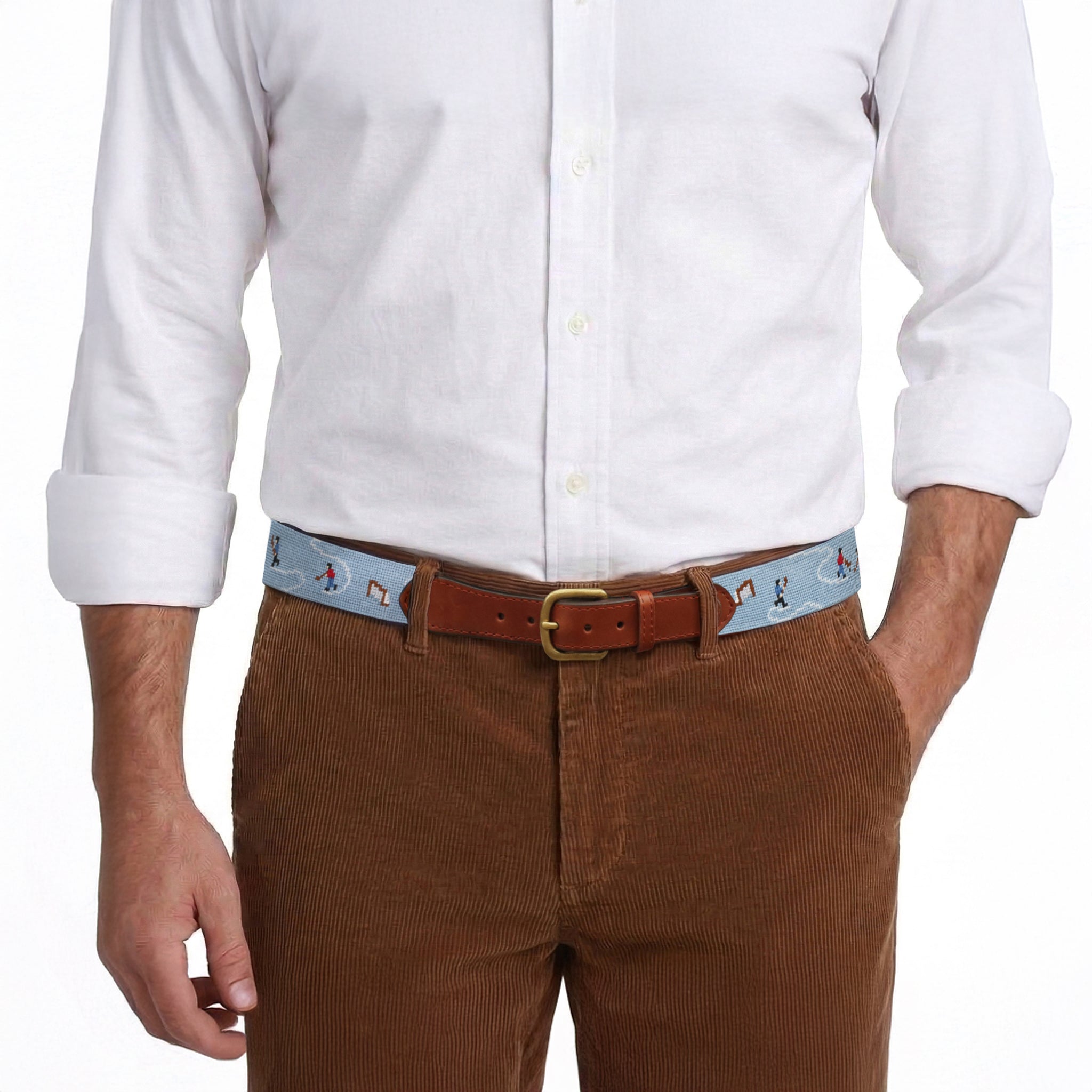 Model wearing Smathers and Branson Brown Corduroy Pants with Pond Hockey needlepoint pattern