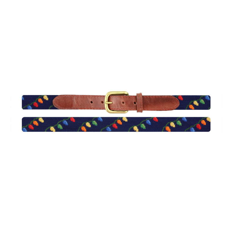 Flat view of Needlepoint Christmas Lights Children's Belt Dark Navy with brown leather trim and a brass buckle