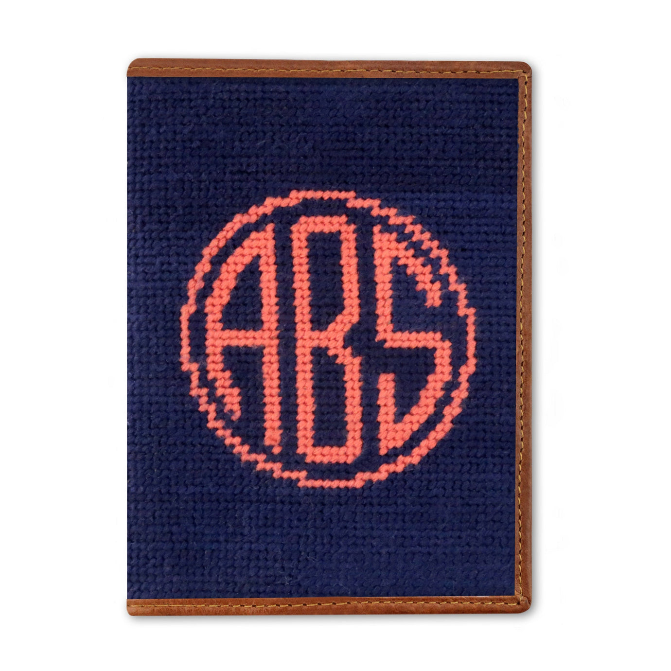 Circle monogram needlepoint passport case in dark navy with full leather construction