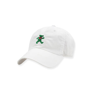 White cap with a green embroidered bear design on a white background