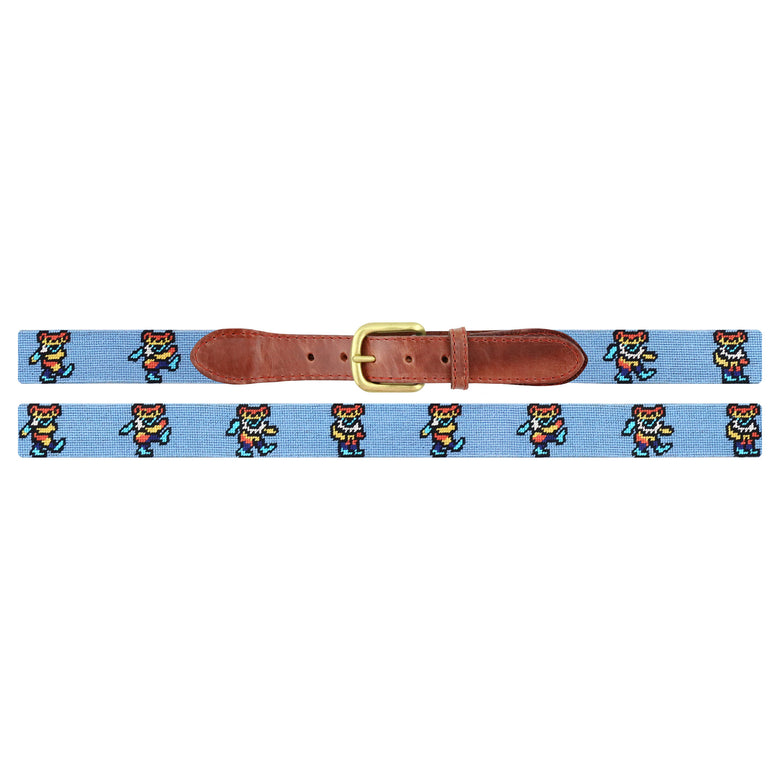 Flat view of Needlepoint Dancing Bears Tie Dye Belt Light Blue with brown leather trim and a brass buckle