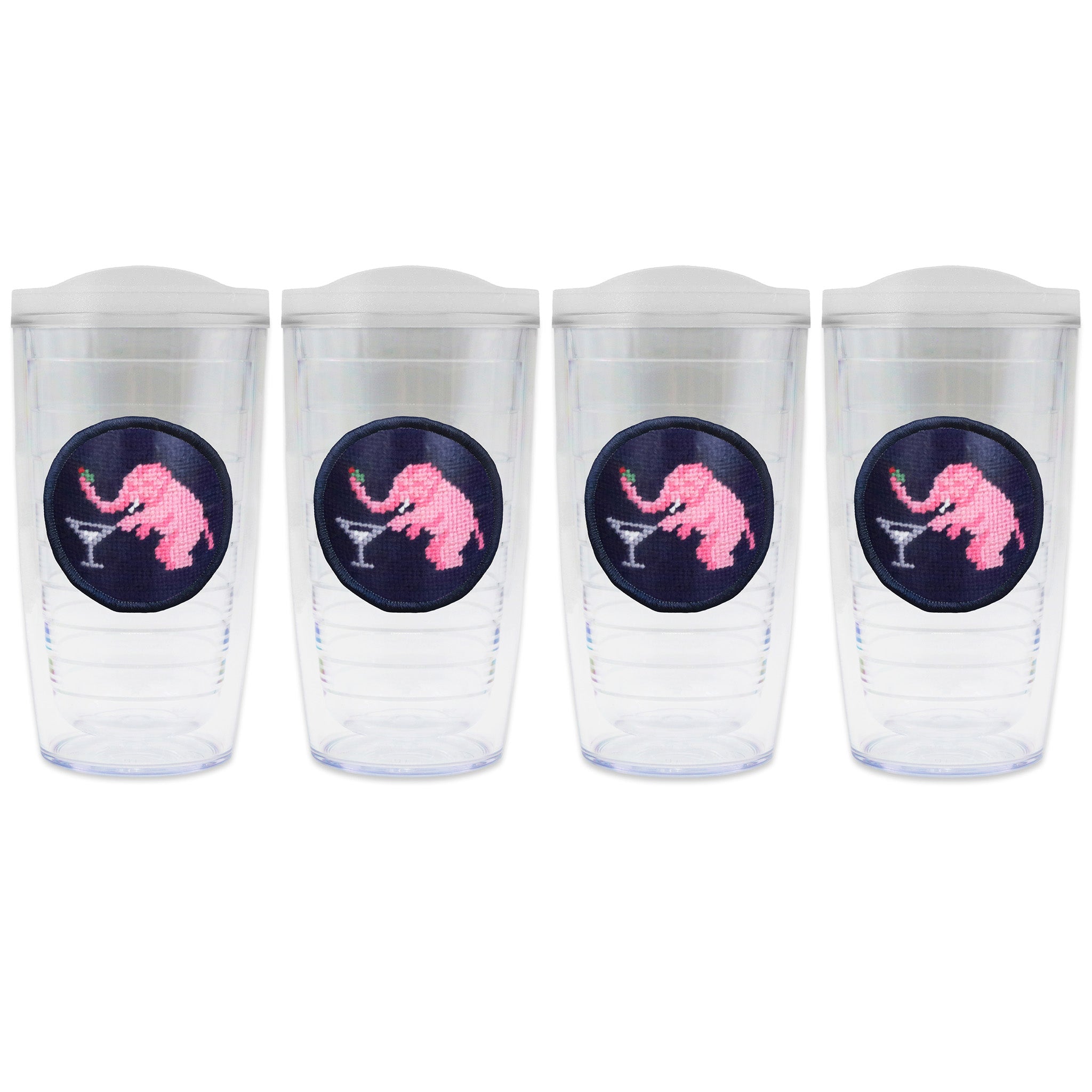 Set of 4 tumblers with lids on each in a line with a needlepoint logo in the center of each tumbler