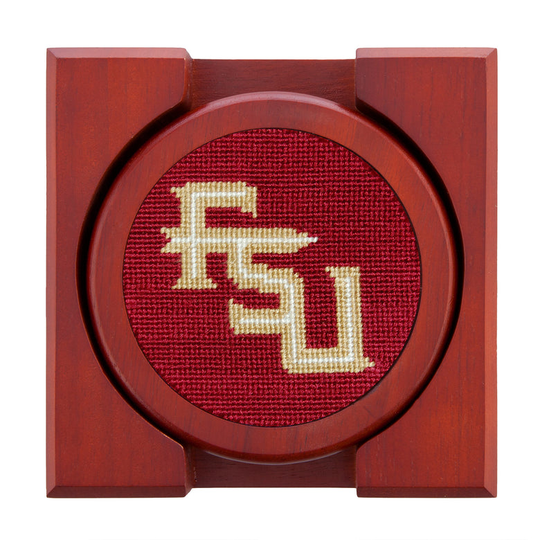 Garnet needlepoint coaster set with the Florida State Seminole logo on one and matching garnet accents, backed with chestnut wood.