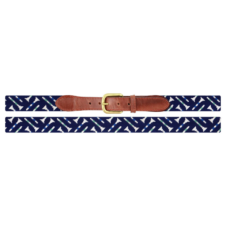 Flat view of Needlepoint Golf Tee Pattern Belt Dark Navy with brown leather trim and a brass buckle