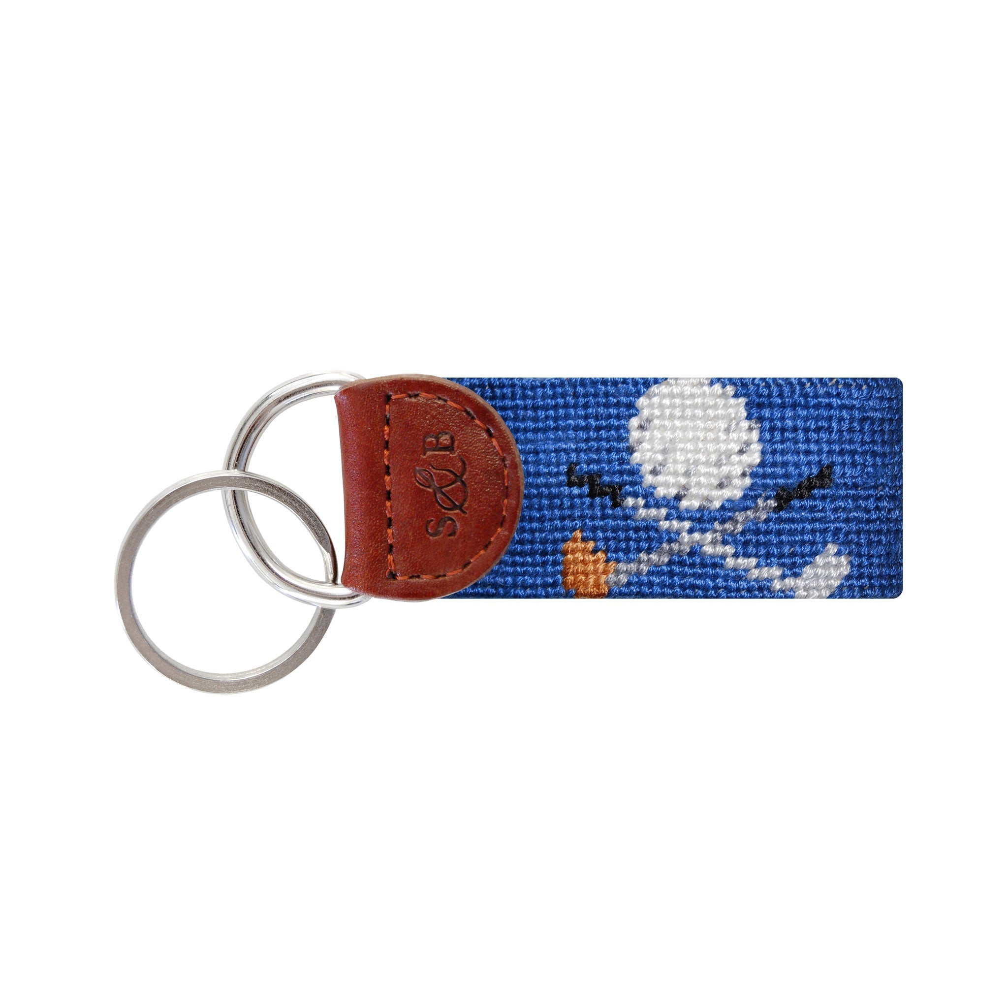 Blueberry needlepoint key fob featuring white golf clubs, brown leather trim, and a metal key ring.