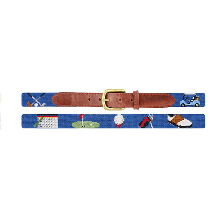 Golf-themed stitched design on a blueberry needlepoint children’s belt with brown leather ends and a brass buckle.