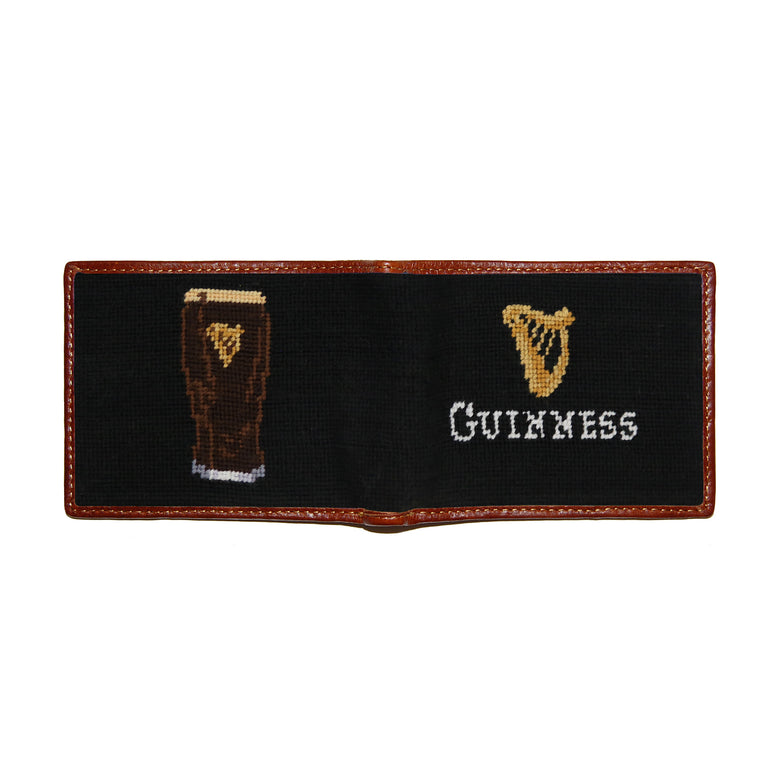 Guinness Harp text needlepoint bi-fold wallet in black with chestnut leather trim, shown from secondary angle showing interior needlepoint.