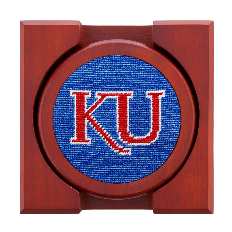 Kansas-themed needlepoint coaster set with the Jayhawk on one and coordinating blue and red patterns, backed with chestnut wood.
