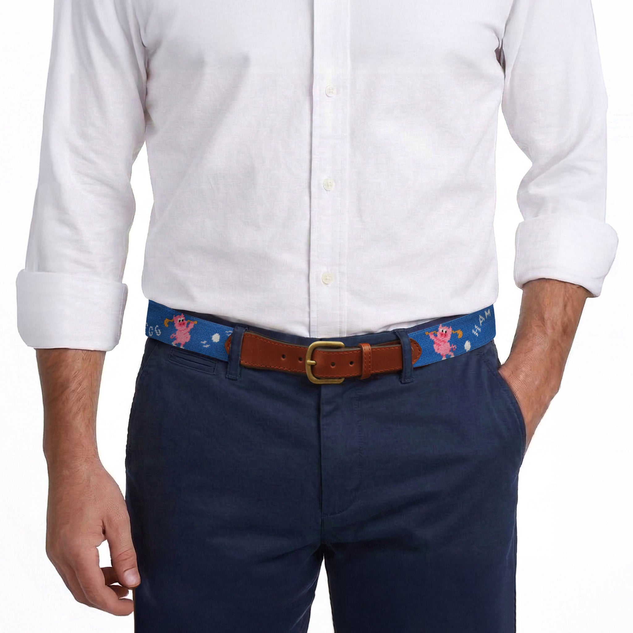Model wearing Smathers and Branson Navy Pants with Ham and Egging needlepoint pattern