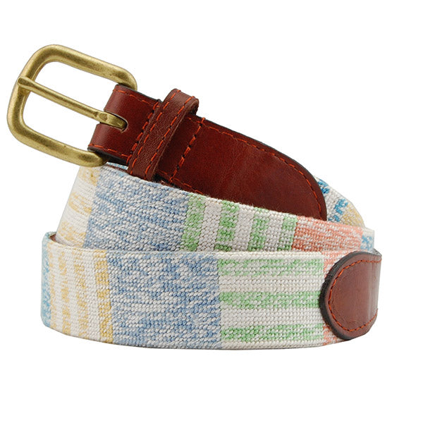 Multicolored belt with a brass buckle on a white background