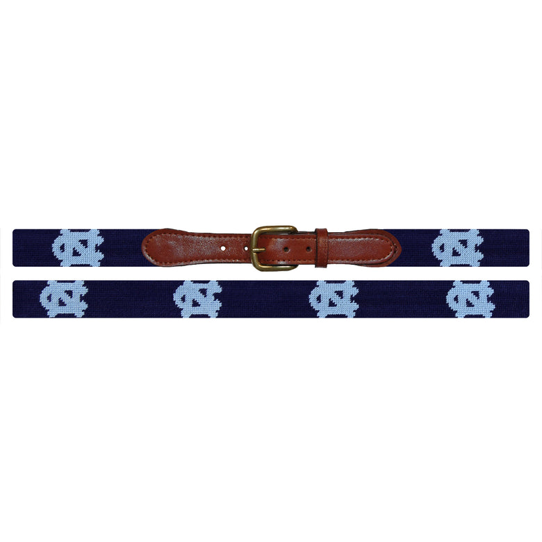 Flat view of Needlepoint UNC Belt Dark Navy with brown leather trim and a brass buckle