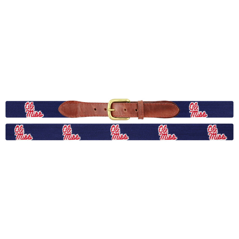 Flat view of Needlepoint Mississippi Belt Dark Navy with brown leather trim and a brass buckle