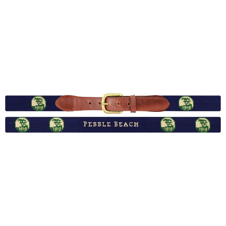 Flat view of Needlepoint Pebble Beach Logo-Text Centered Belt Dark Navy with brown leather trim and a brass buckle