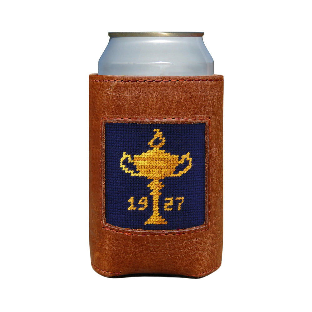 Brown leather can cooler with a needlepoint design of a trophy and '1927' on a white background