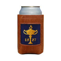 Brown leather can cooler with a needlepoint design of a trophy and '1927' on a white background