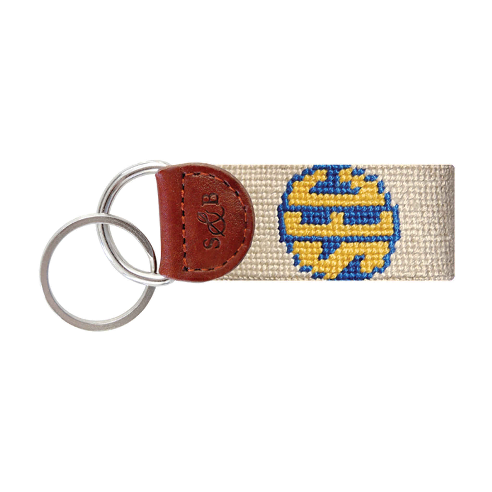 Navy needlepoint key fob with a white “SEC” logo in a blue circle, brown leather trim, and a metal key ring.