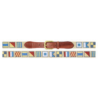 Nautical flag belt with a brown leather buckle on a white background