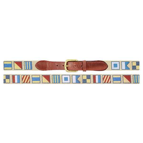 Nautical flag belt with a brown leather buckle on a white background