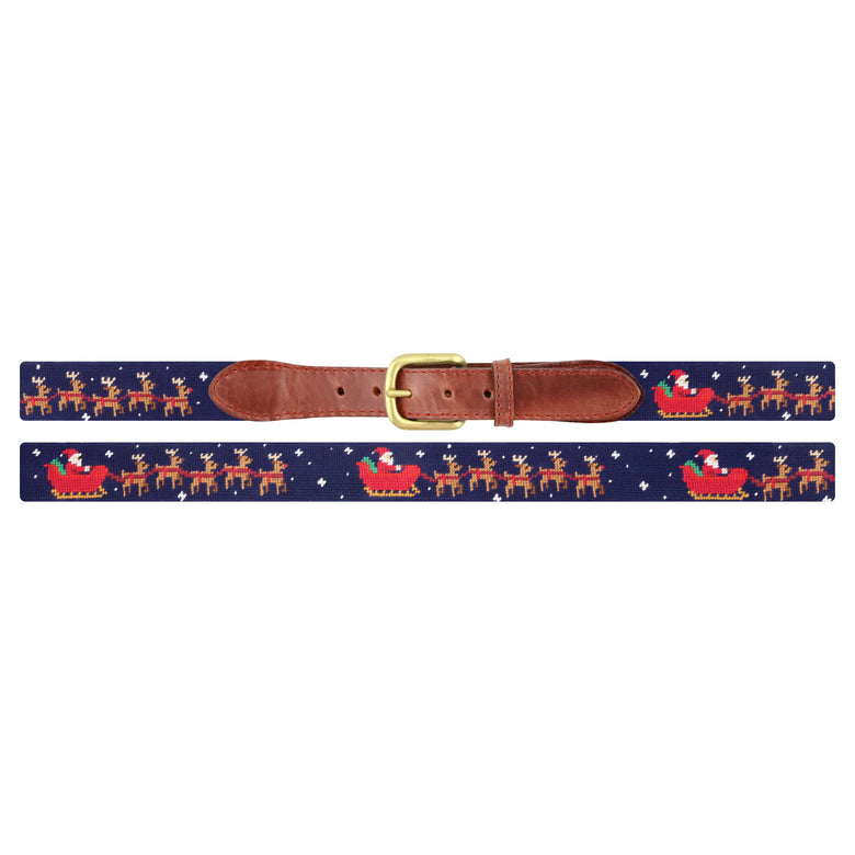 Flat view of Needlepoint Santa's Sleigh Belt Dark Navy with brown leather trim and a brass buckle
