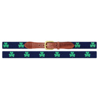 Flat view of Needlepoint Monogrammed Shamrock Belt Dark Navy with brown leather trim and a brass buckle