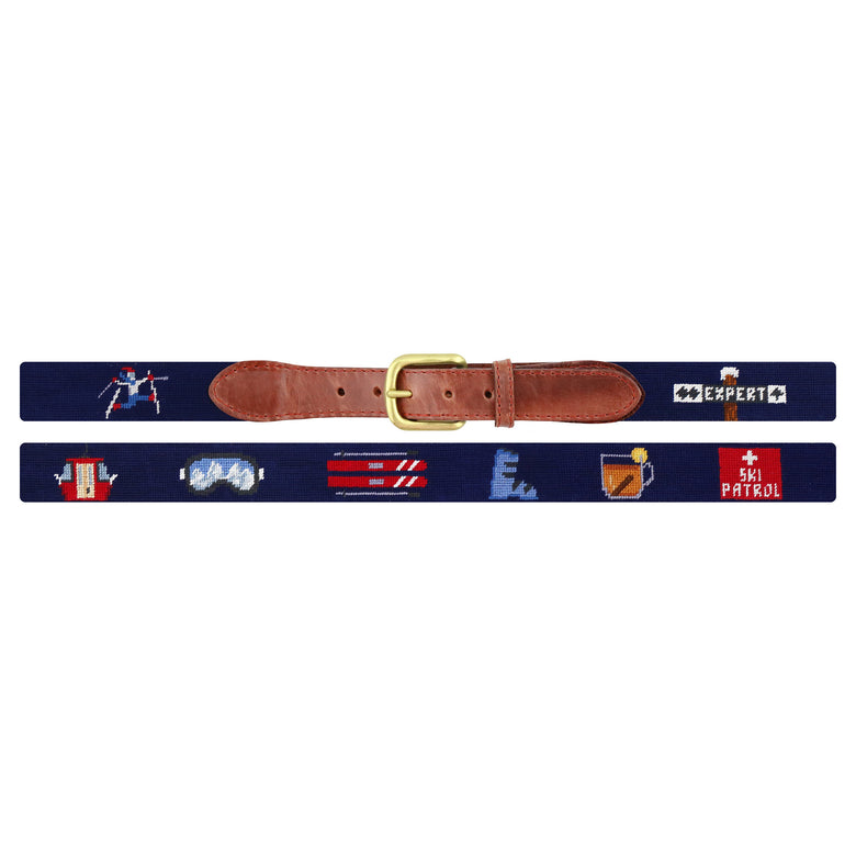 Flat view of Needlepoint Ski Life Belt Dark Navy with brown leather trim and a brass buckle