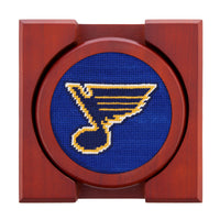 St. Louis Blues logo on a blue background with a wooden frame