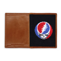 Two-tone passport case with leather section and embroidered design on a white background