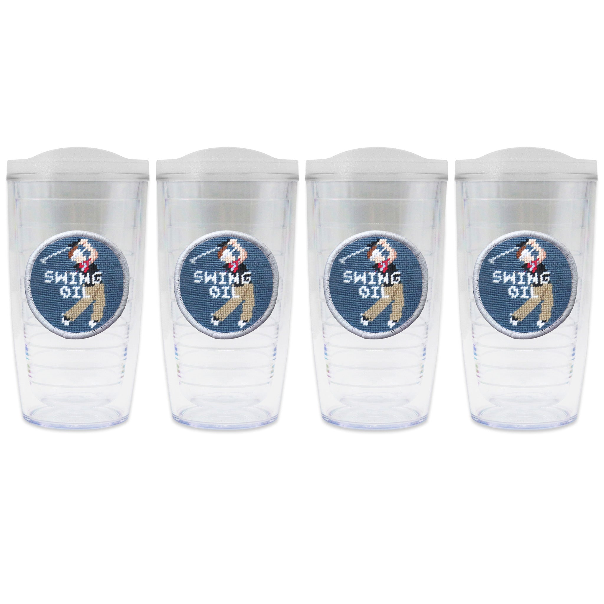 Set of 4 tumblers with lids on each in a line with a needlepoint logo in the center of each tumbler