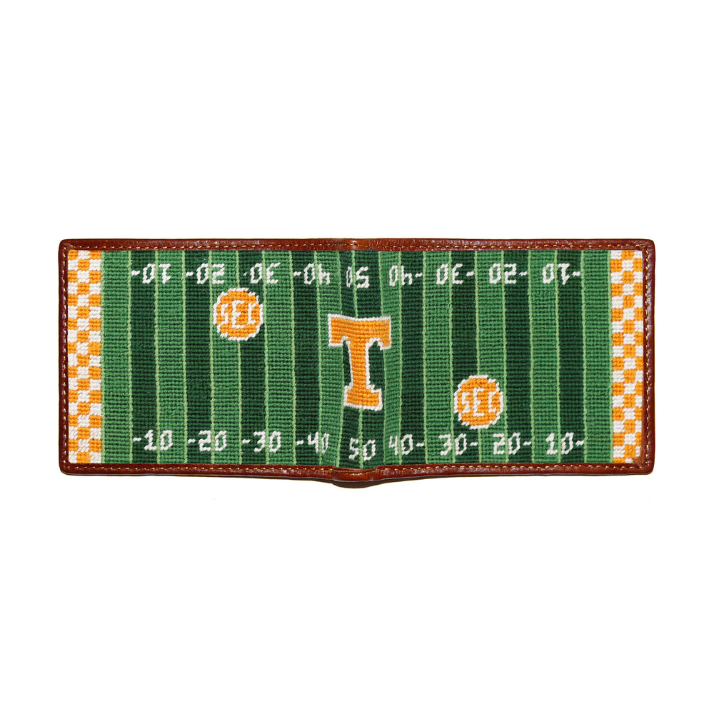 Football field design wallet with checkered border on a white background