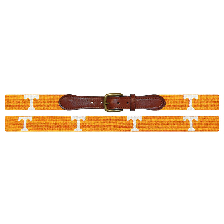 Flat view of Needlepoint Tennessee Power T Belt Orange with brown leather trim and a brass buckle