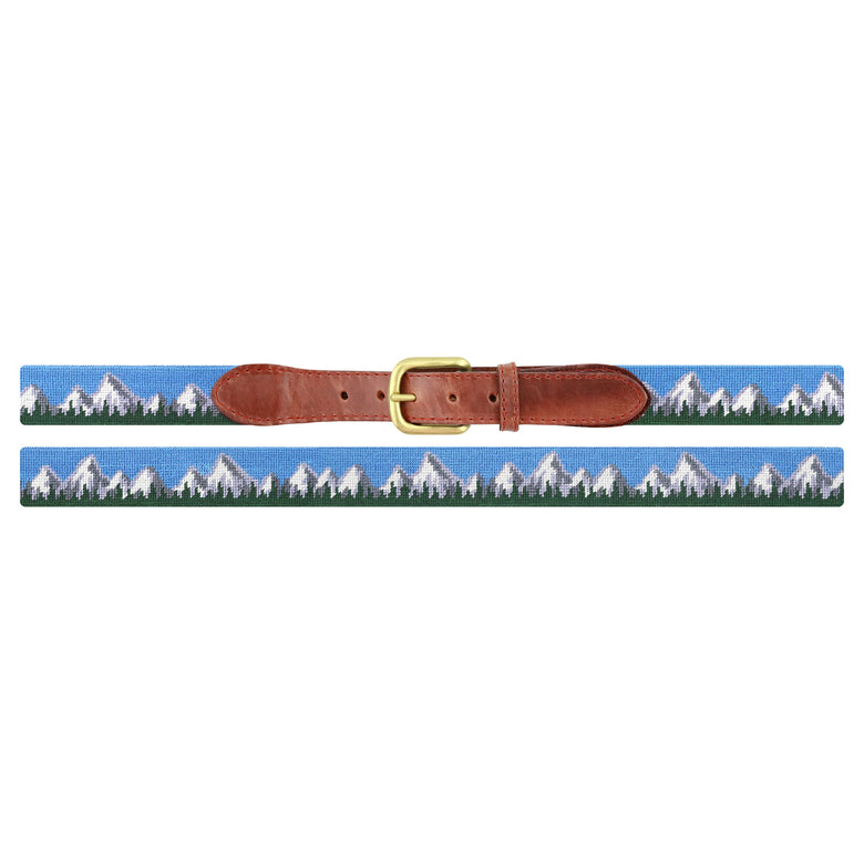 Flat view of Needlepoint Tetons Belt with brown leather trim and a brass buckle
