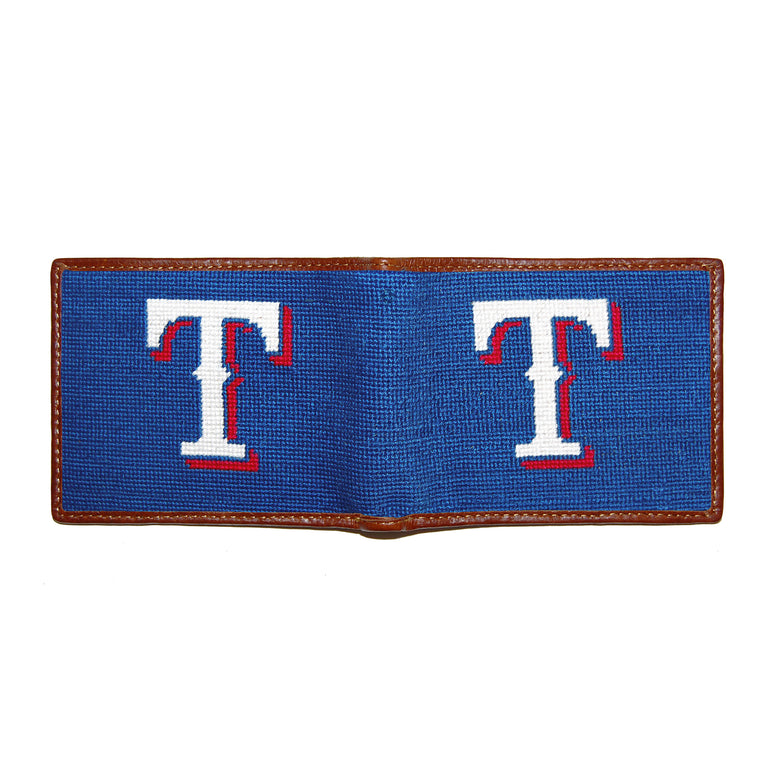 Texas Rangers navy needlepoint bi-fold wallet open to show both sides of the red, white, and blue Rangers logo needlepoint design with brown leather trim.