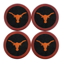 Black coaster featuring a stitched Texas design in white, shown laid flat.