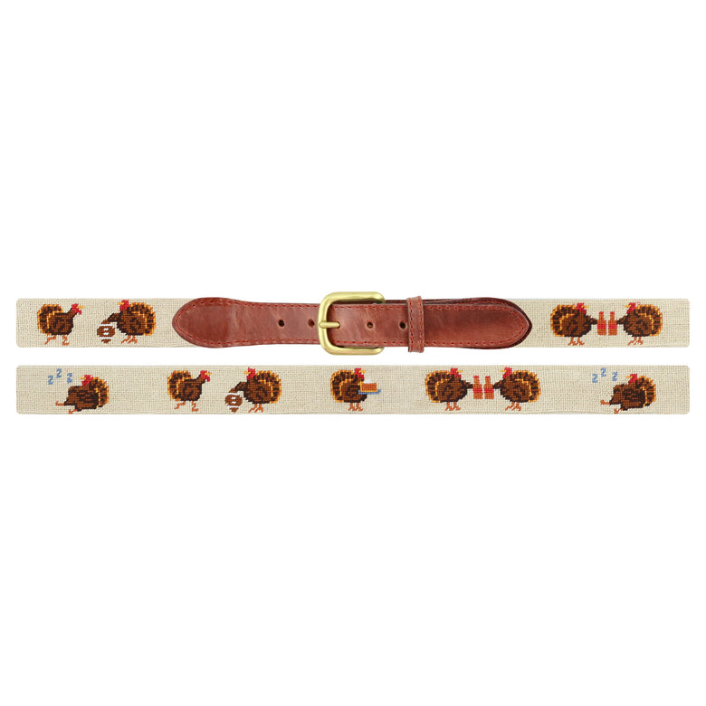 Flat view of Needlepoint Turkey Day Belt Light Khaki with brown leather trim and a brass buckle